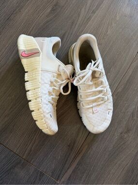 Nike Women’s Cream Athletic Sneakers with Pink Swoosh Accent